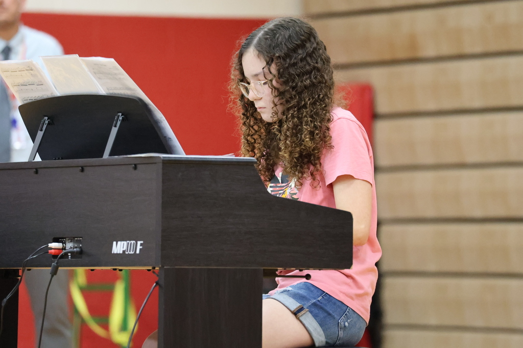 A student plays the keyboard.