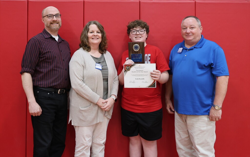 Kiwanis Club embers with the recipient of this year's Student of the Year Award.
