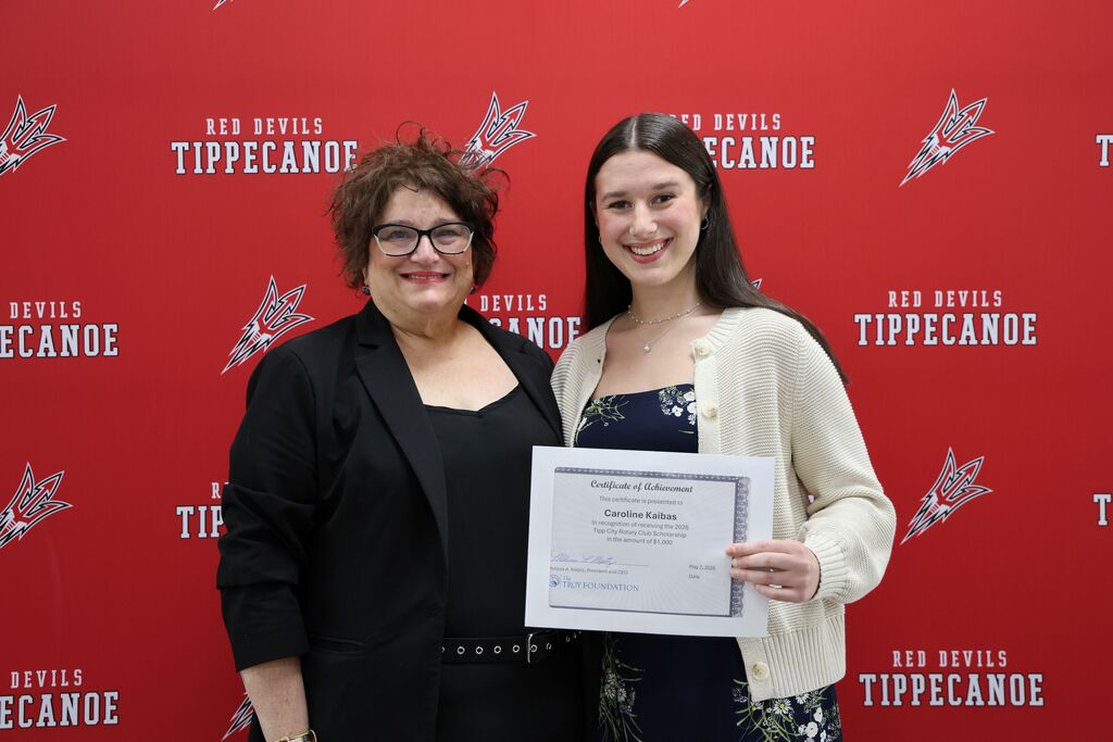 Tipp City Rotary representative with a THS graduate who received the organization's scholarship.