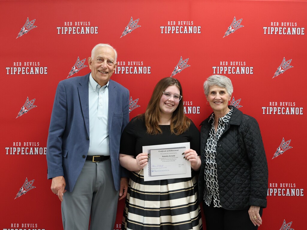 The Wilheims pictured with the Class of 2026 student who received their family's scholarship.