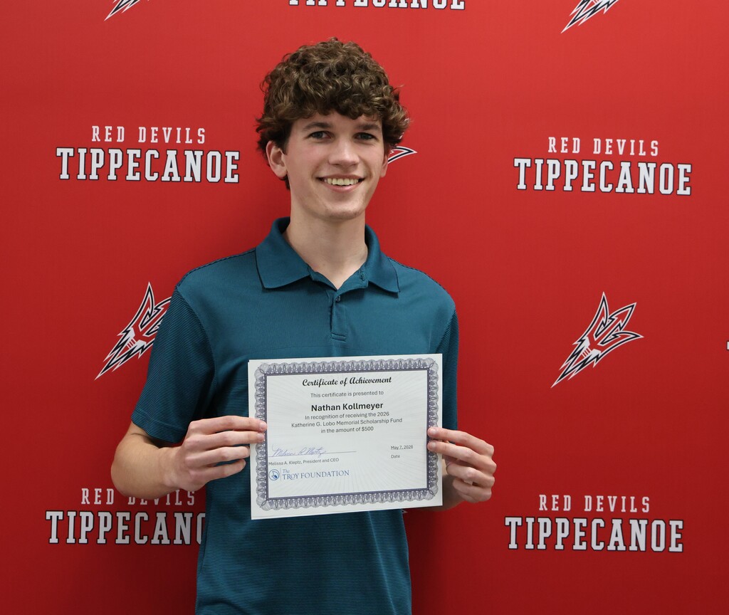 THS graduate Nathan Kollmeyer holds his certificate after receiving the Kitty Lobo Memorial Scholarship.