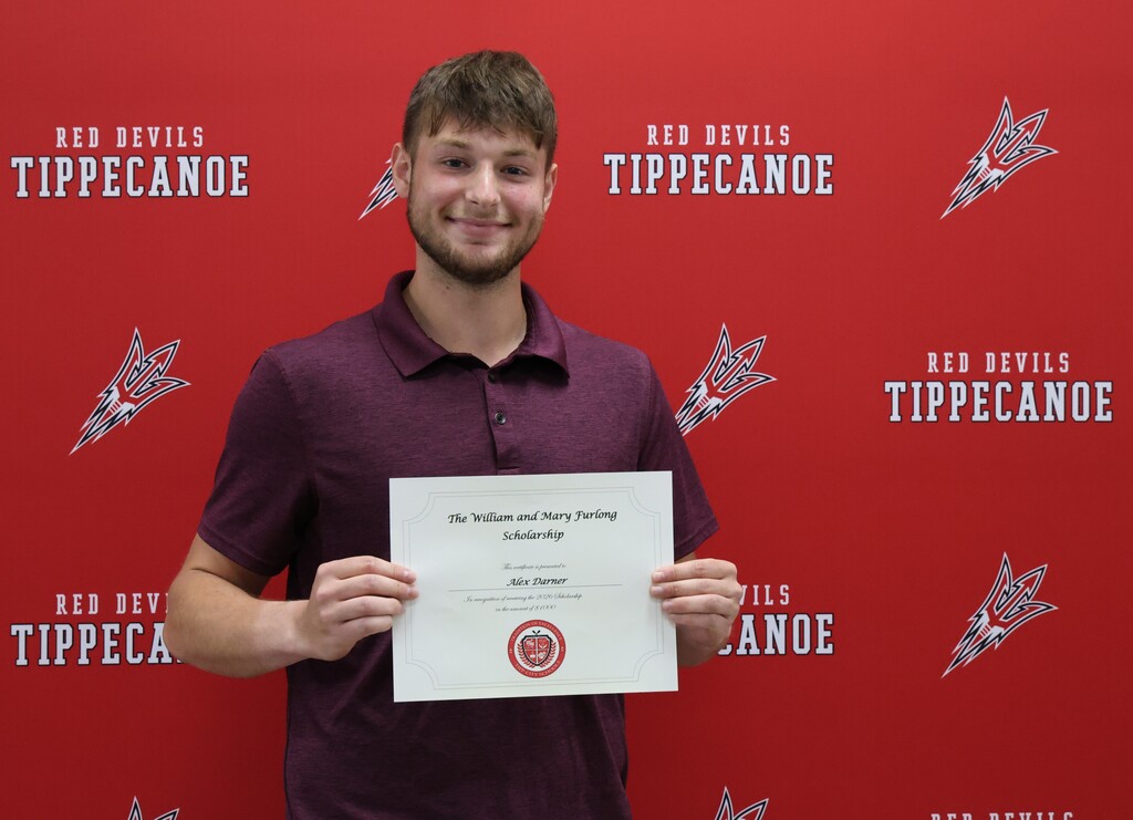 THS graduate Alex Darner with his certificate after winning the William and Mary Furlong Scholarship.