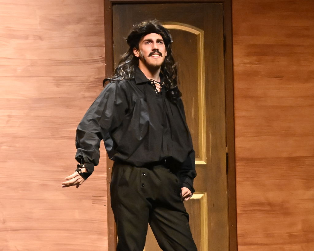 A THS student performs on stage in Peter and the Starcatcher.