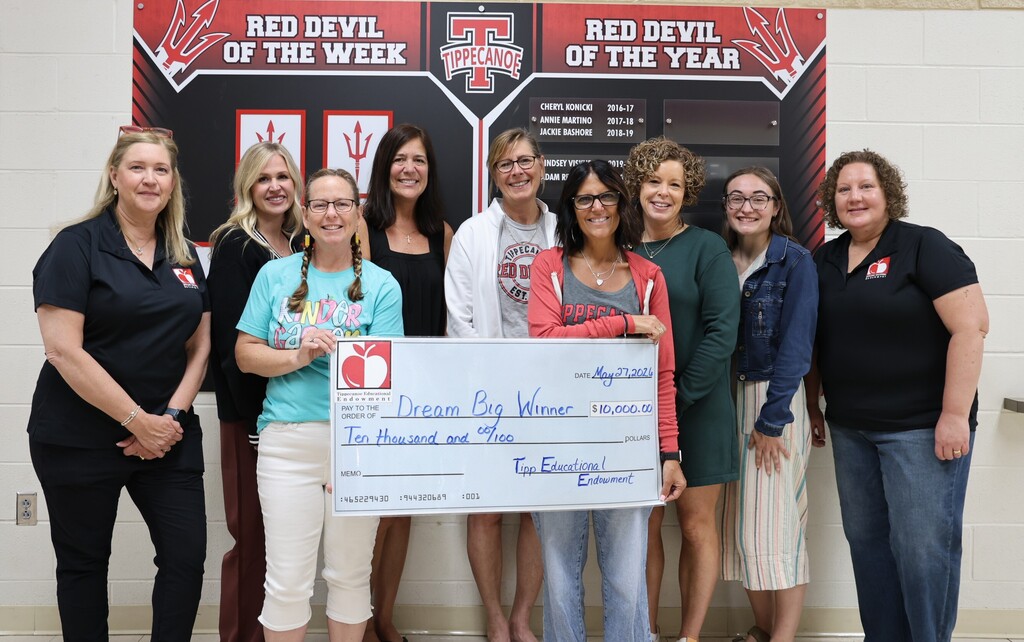 TEE awarded the Dream Big grant to Broadway Elementary.  They pose with some of the teachers.