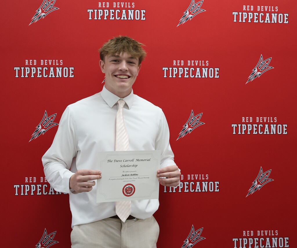 Dave Carroll Memoral Scholarship recipient with his certificate.
