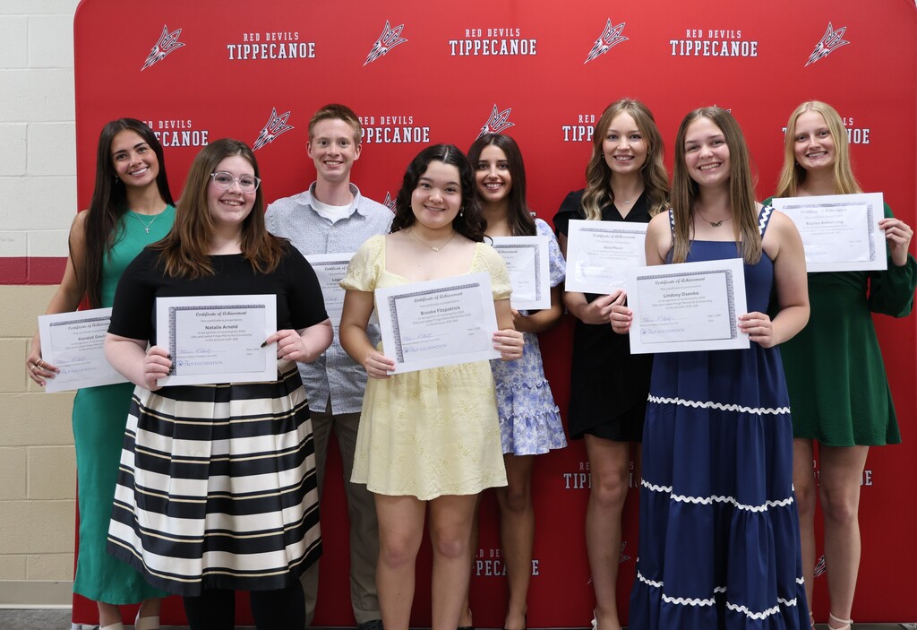 Class of 2026 scholarship recipients hold their certificates.