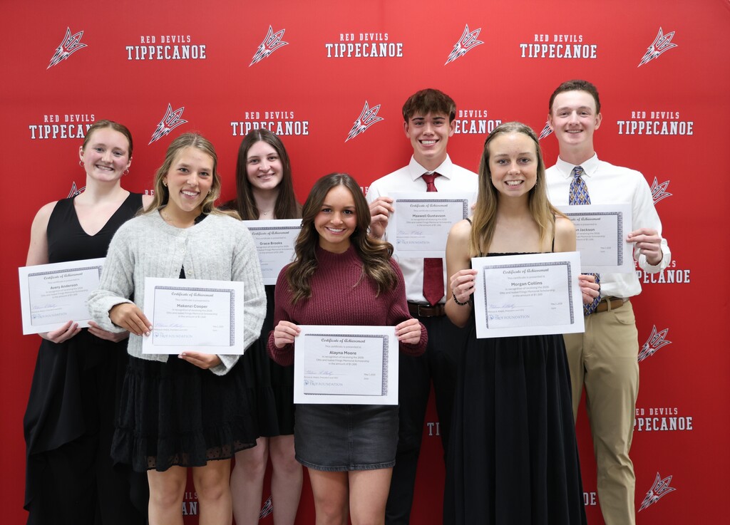 Class of 2026 scholarship recipients hold their certificates.
