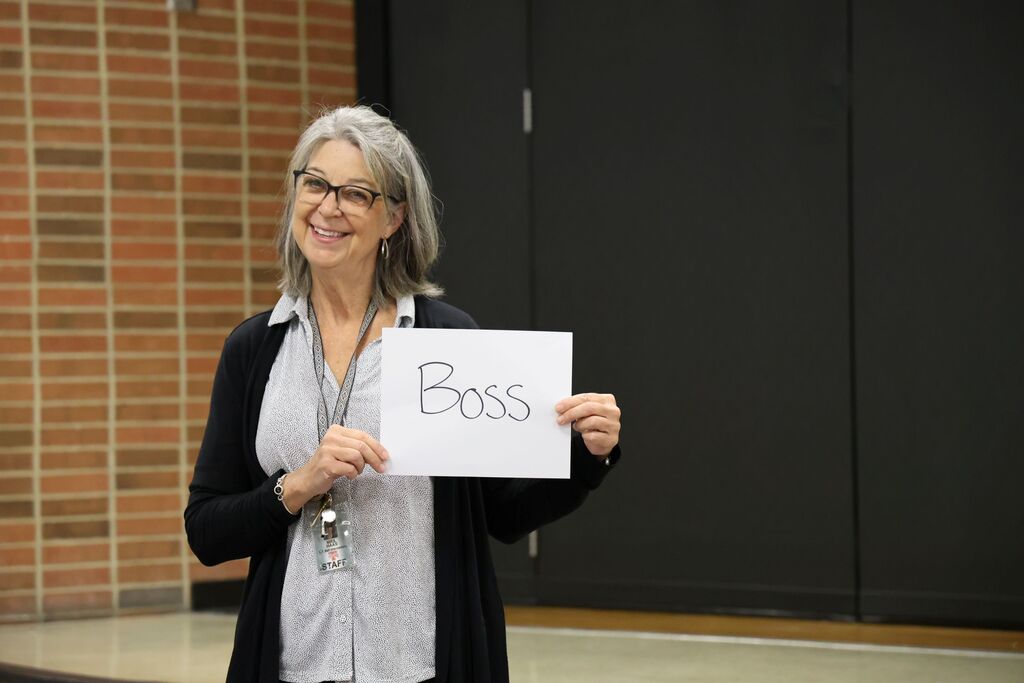 Mrs. Haas is the "Boss" during" a presentation with the owner of Topsy Turvy.