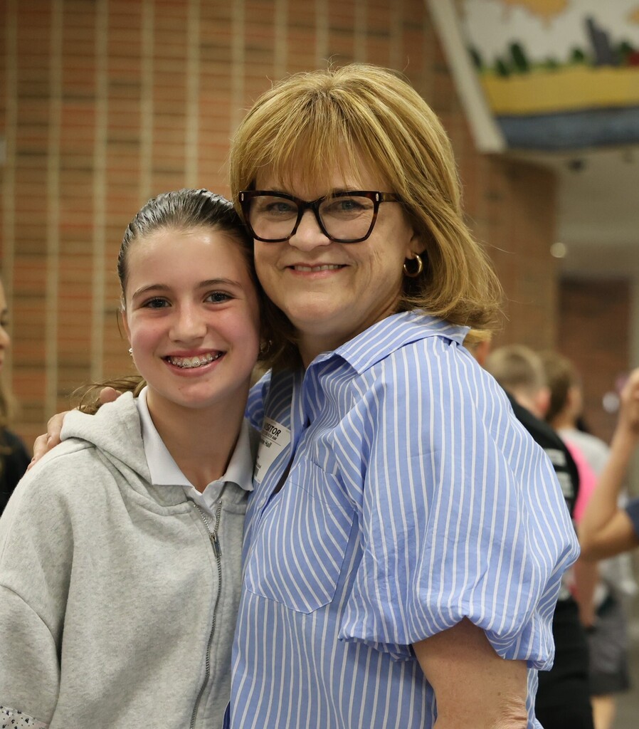 The owner of Topsy Turvy poses with an LT Ball student.