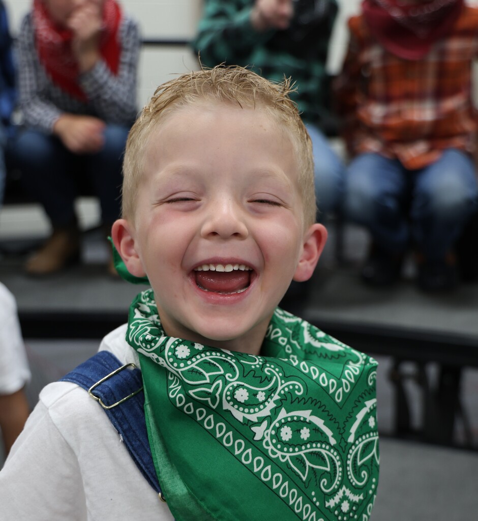 A student is all dressed up in his flannel shirt and bandana for the Moosical. 