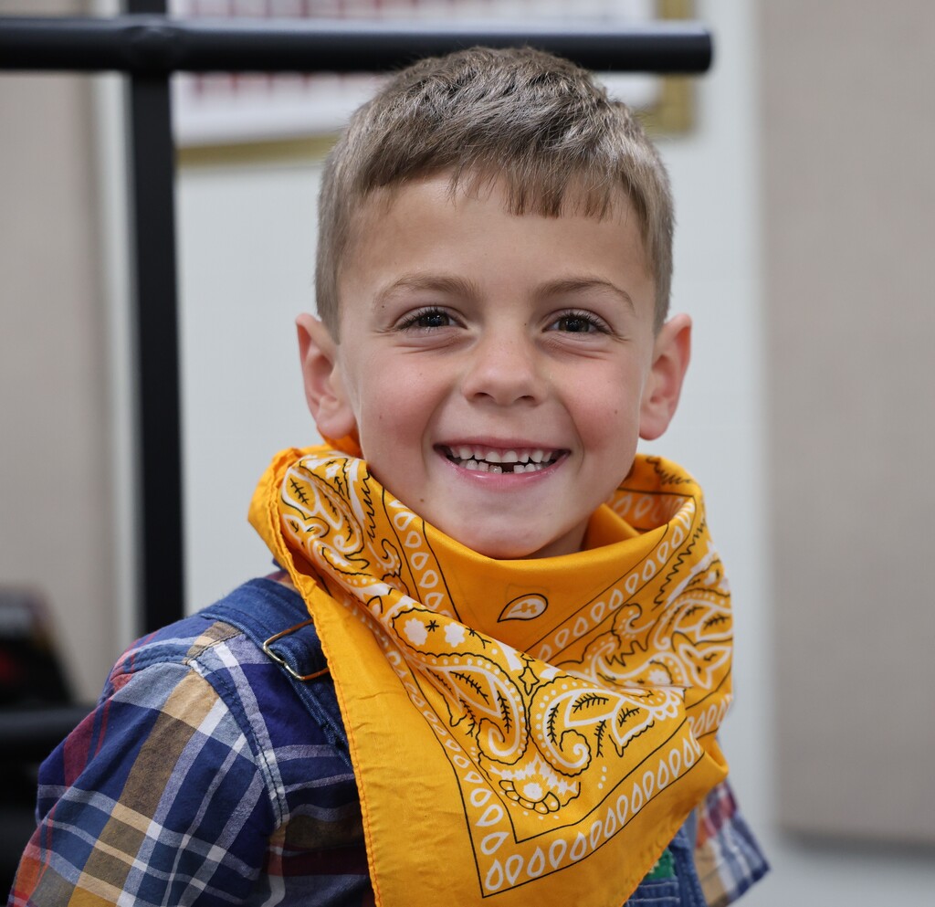 A student is all dressed up in his flannel shirt and bandana for the Moosical. 