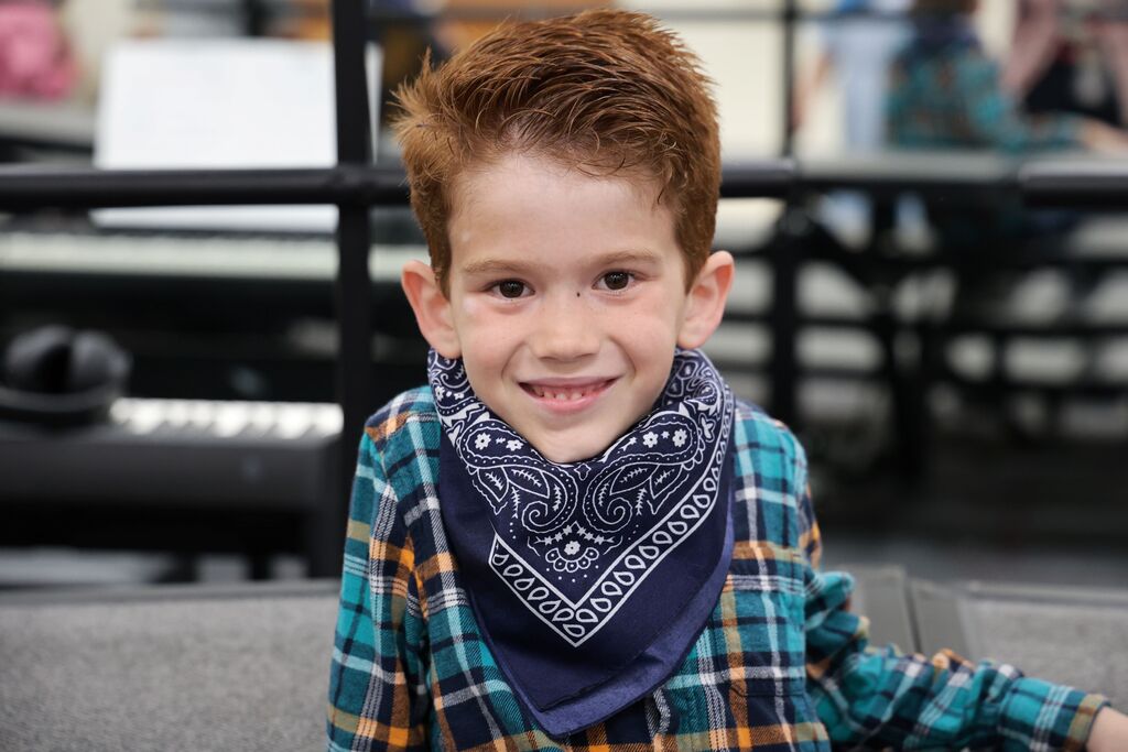 A student is all dressed up in his flannel shirt and bandana for the Moosical. 