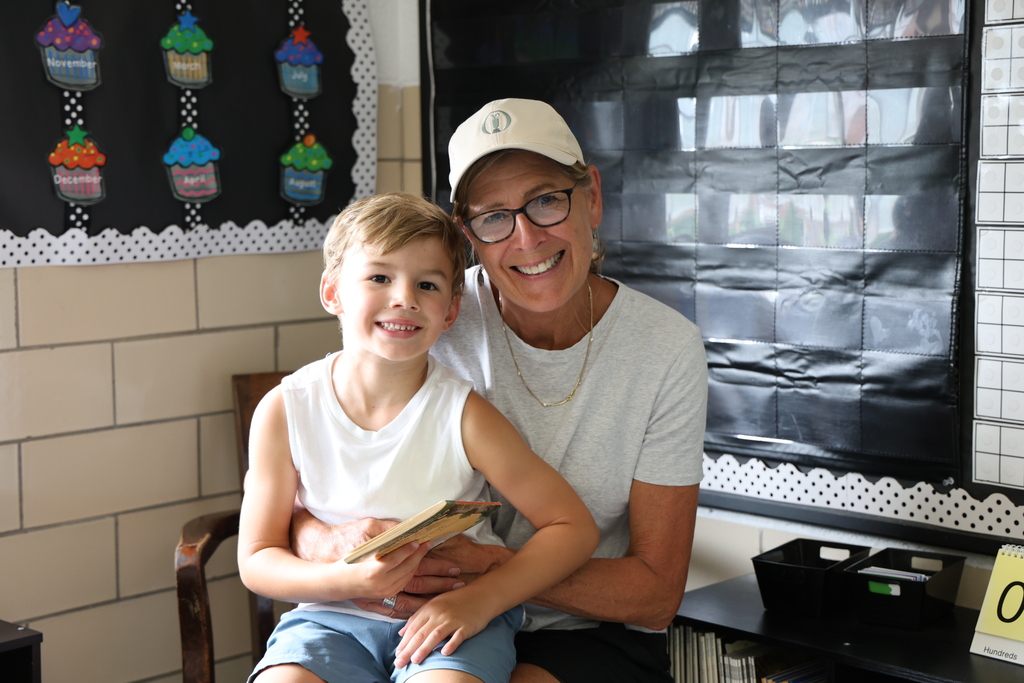 Nancy Carus with her five year old grandson who helped her set up the classroom. 