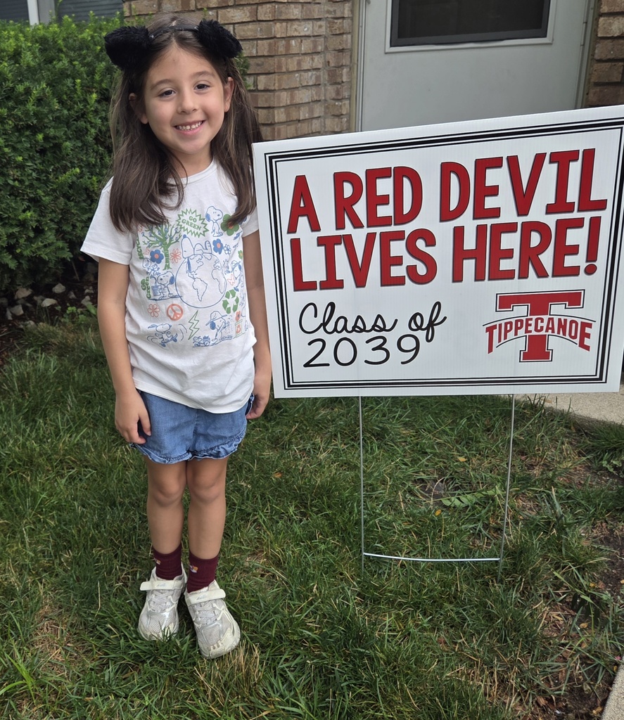 A Red Devil student poses with the new kindergarten Class of 2039 sign.