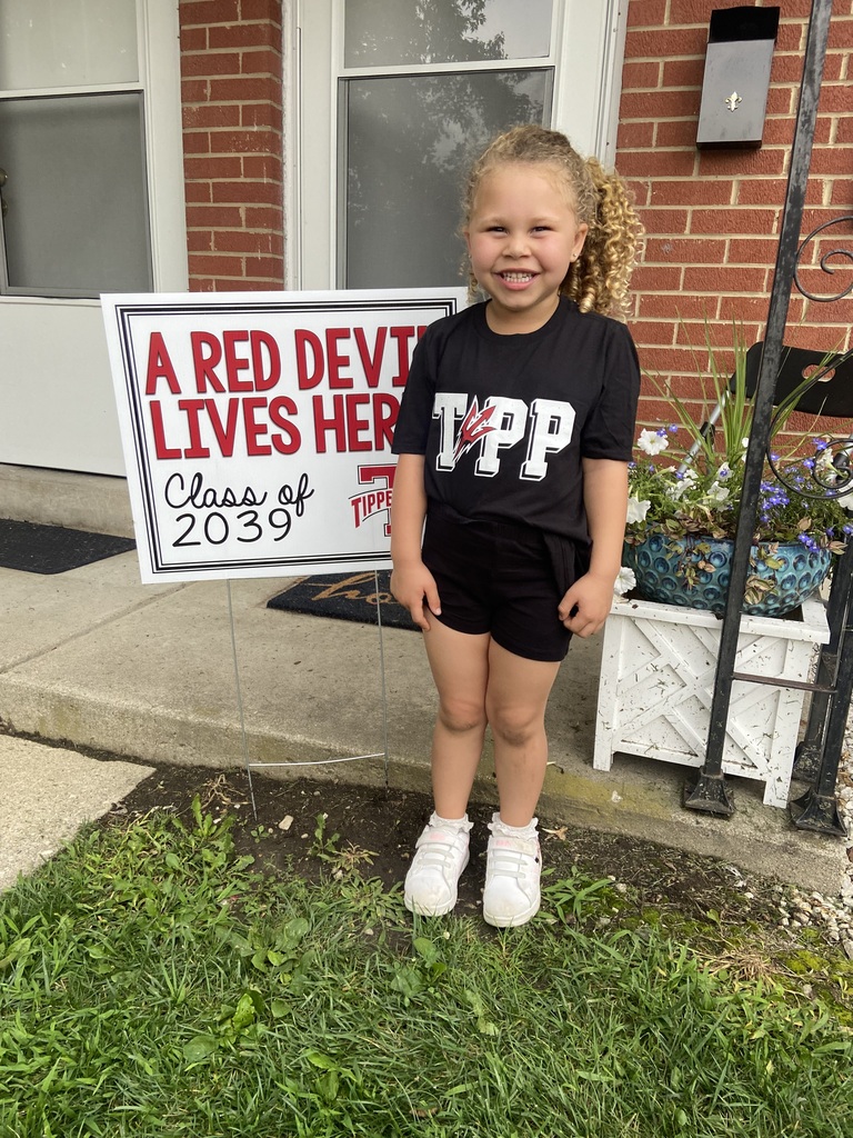 A Red Devil student poses with the new kindergarten Class of 2039 sign.