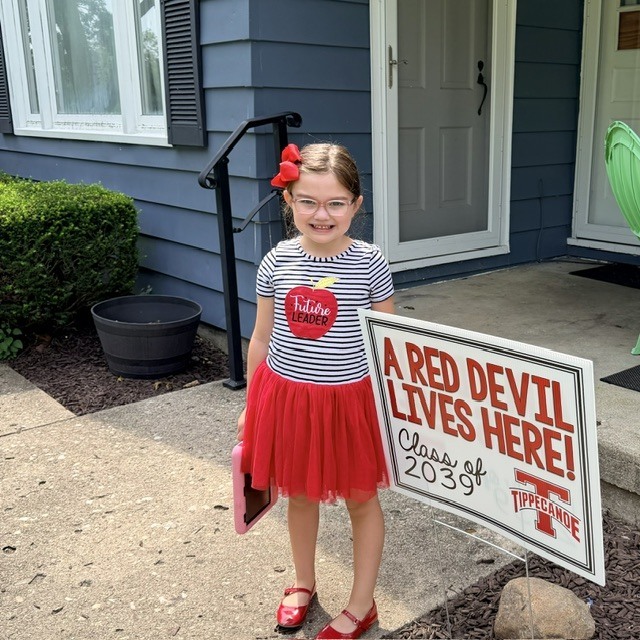 Kindergarten Red Devils shows off the Class of 2039 sign.  