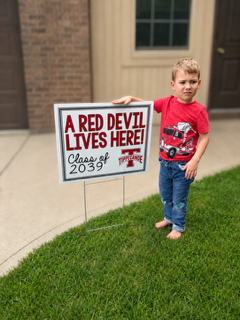 Kindergarten Red Devils shows off the Class of 2039 sign.  