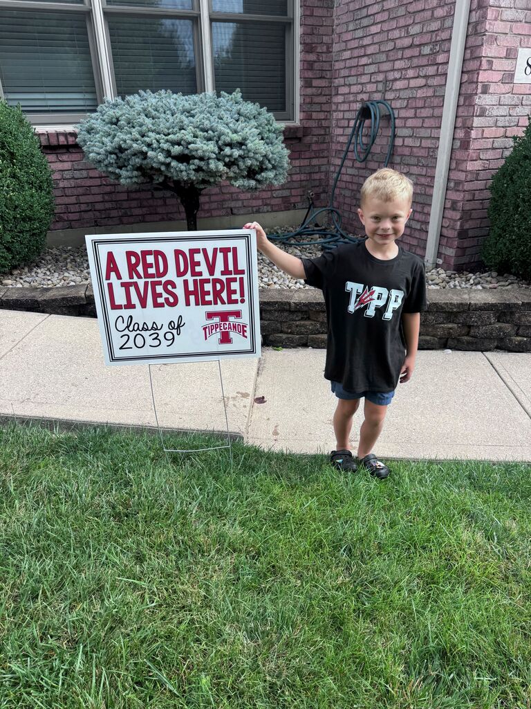 Kindergarten Red Devils shows off the Class of 2039 sign.  
