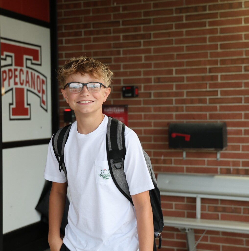 A TMS student outside the building on the first day of a new school year.