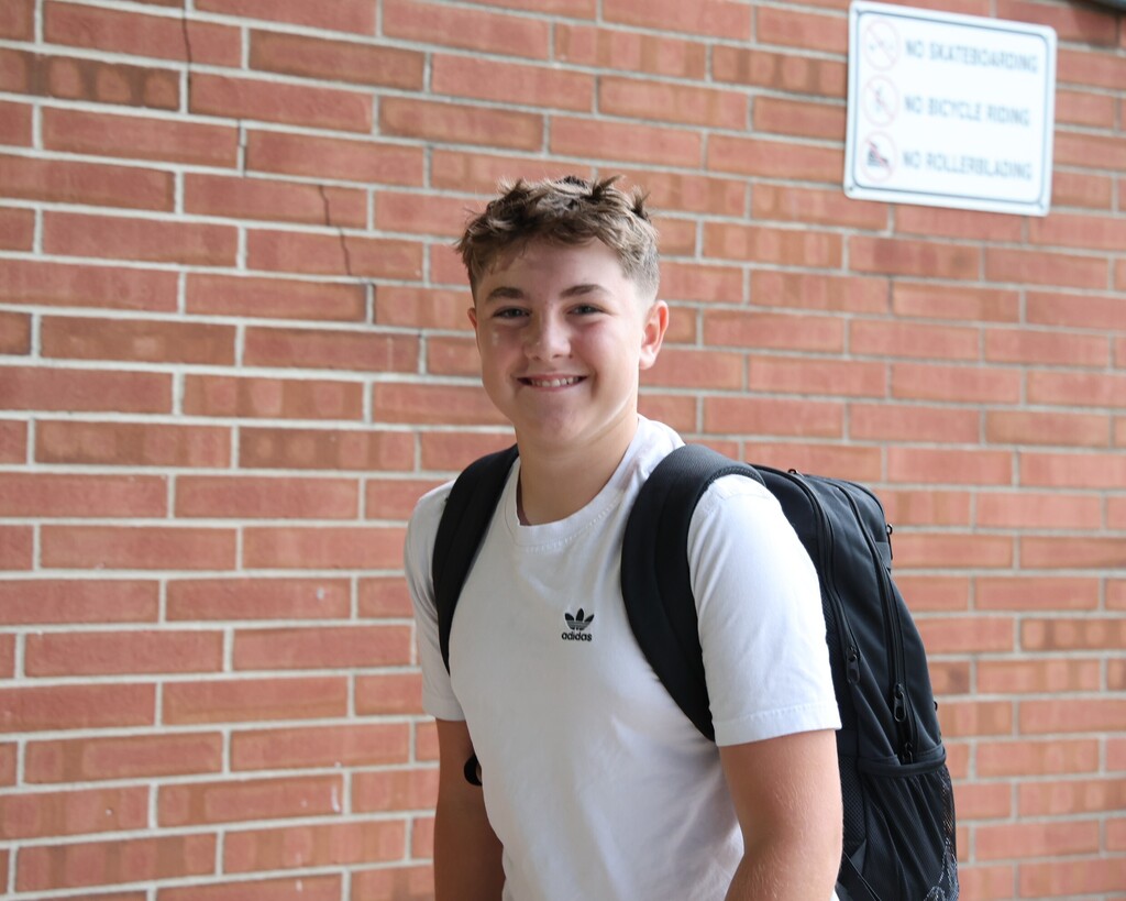 A TMS student outside the building on the first day of a new school year.