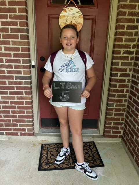 An LT Ball student poses for her first day of school photo.