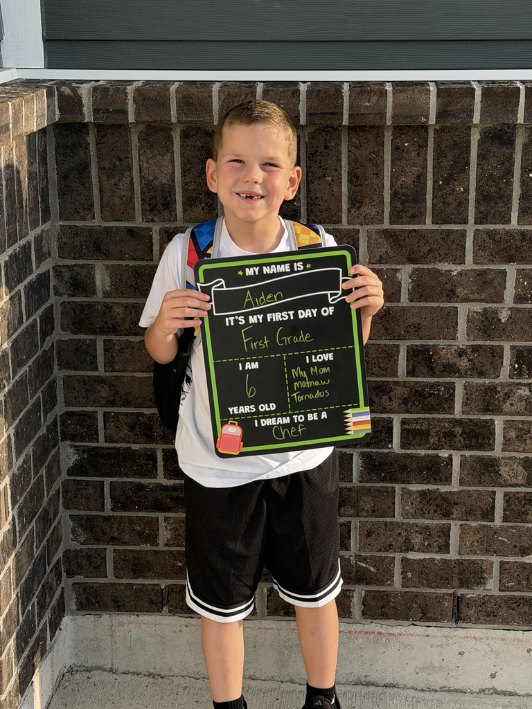 A student poses for his first day of school.