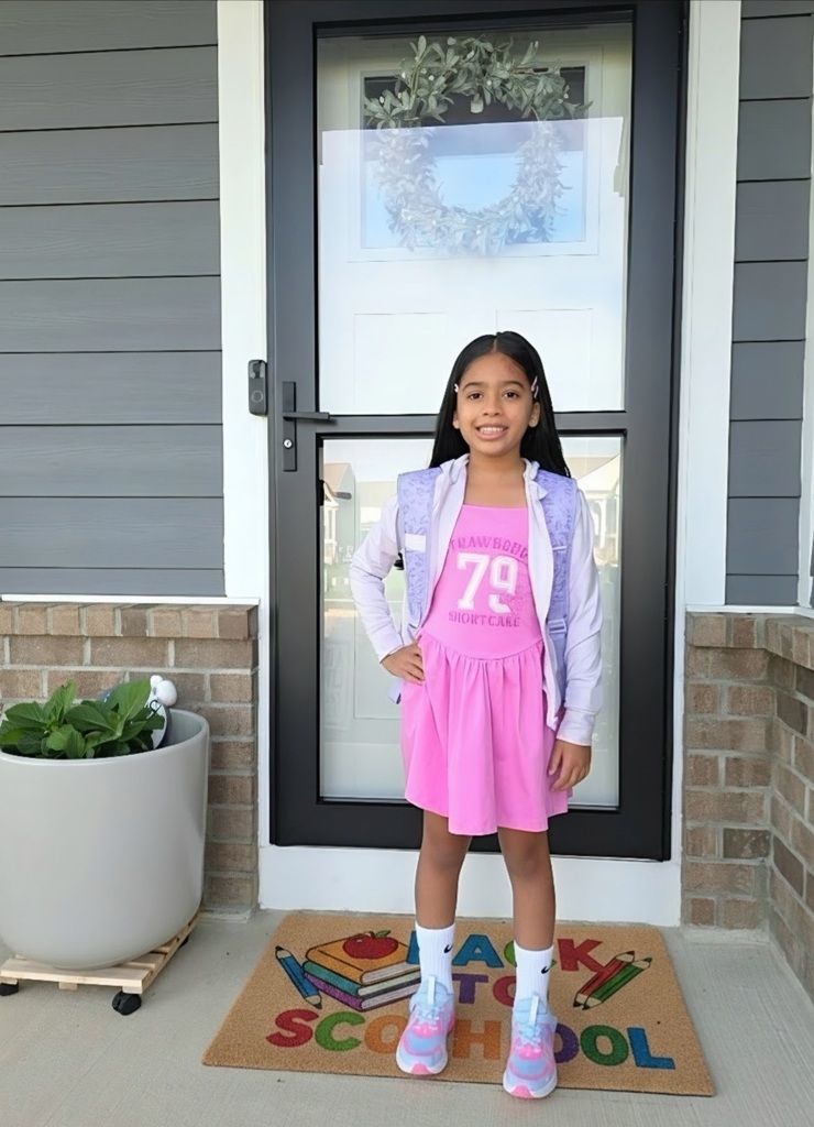 A student poses for the first day picture.