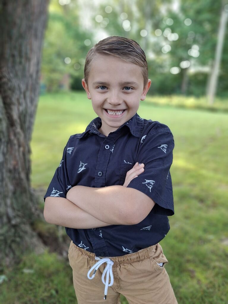 A student poses for the first day picture.