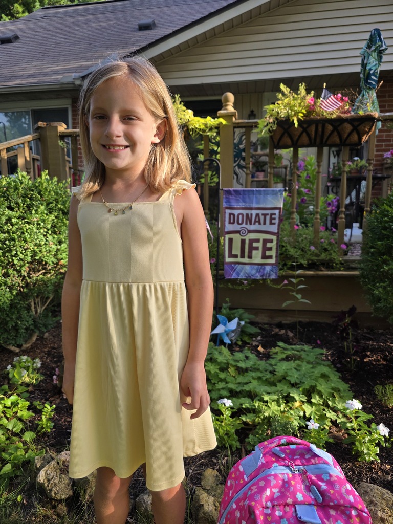 A student poses for the first day picture.