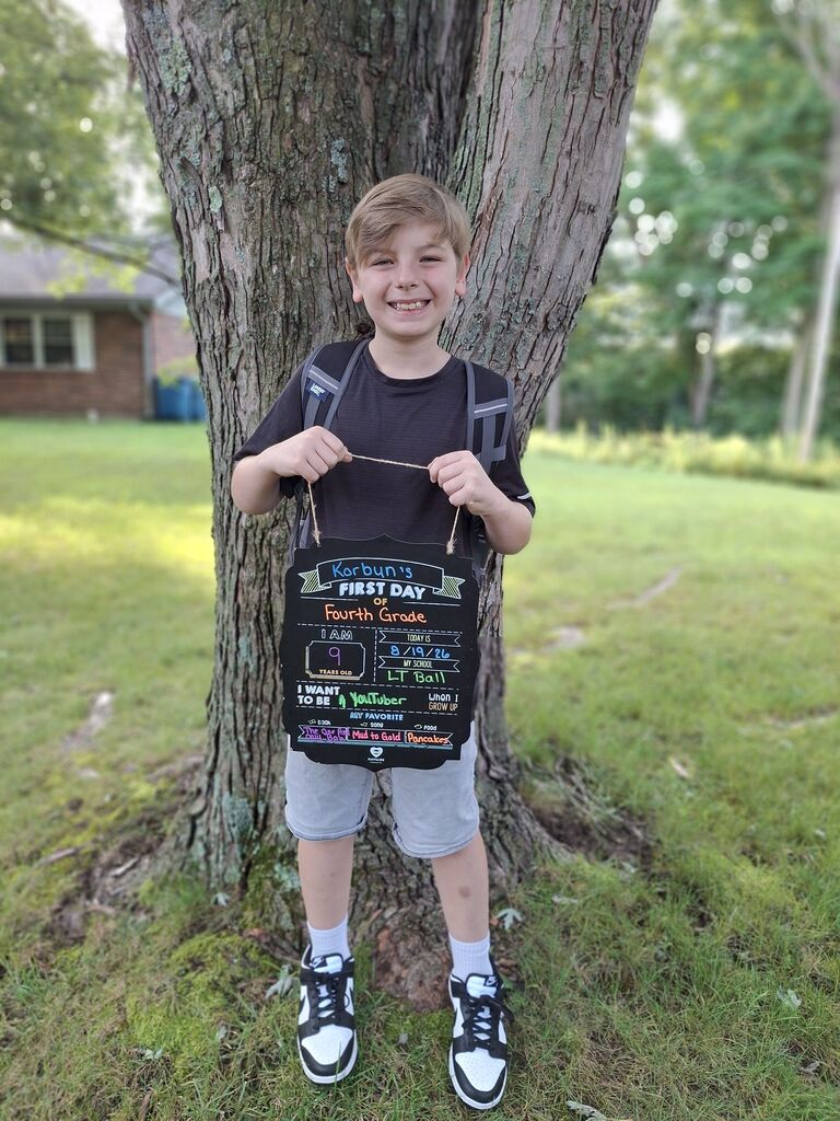 A student poses for the first day picture.
