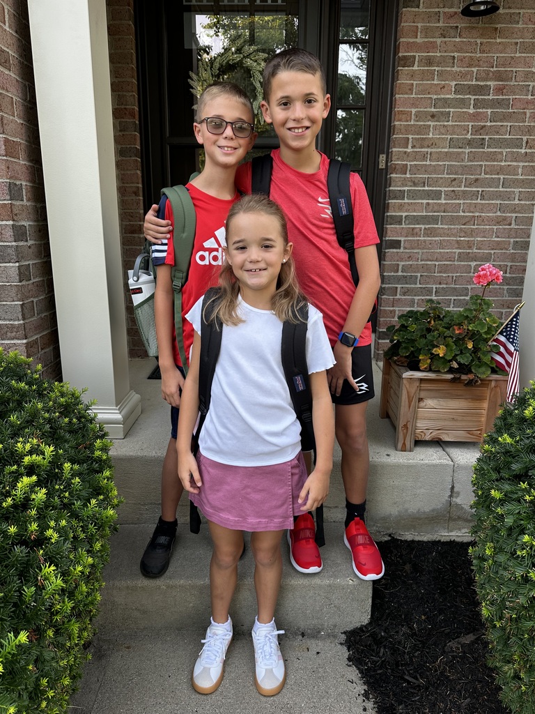 Siblings pose for the first day picture.