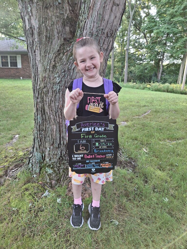 A student poses for the first day picture.
