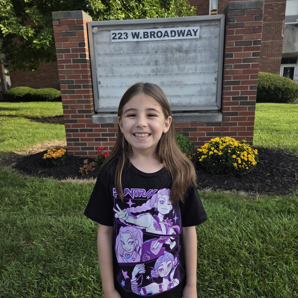 Student posing on the the first day of school.