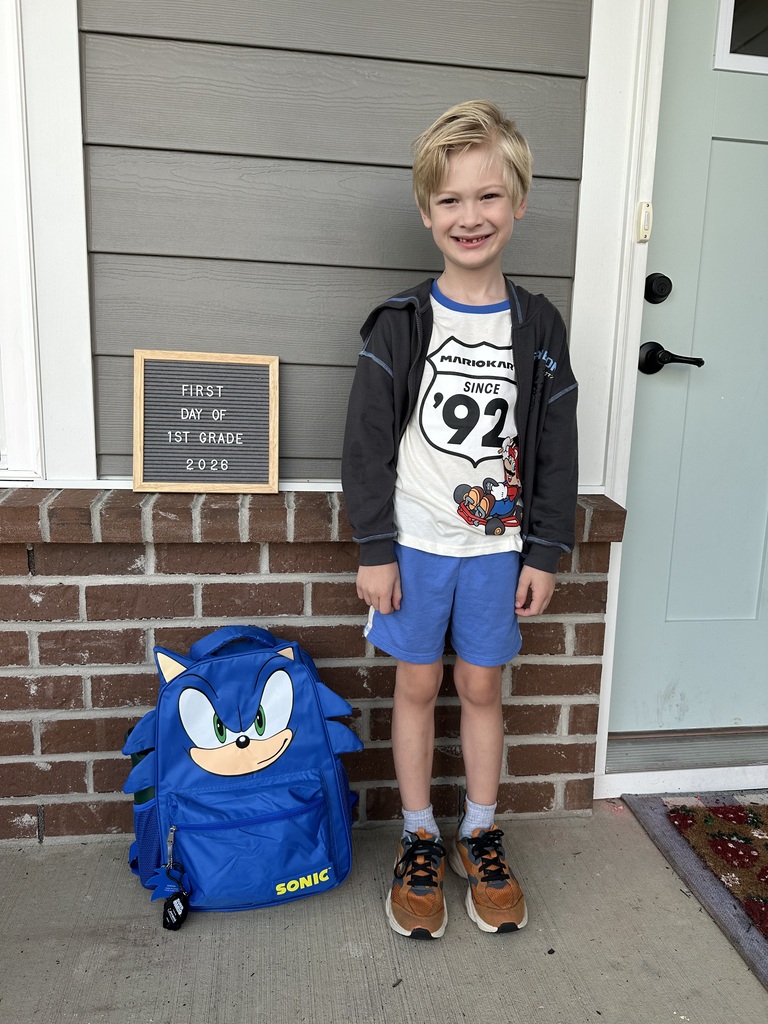 Student posing on the the first day of school.