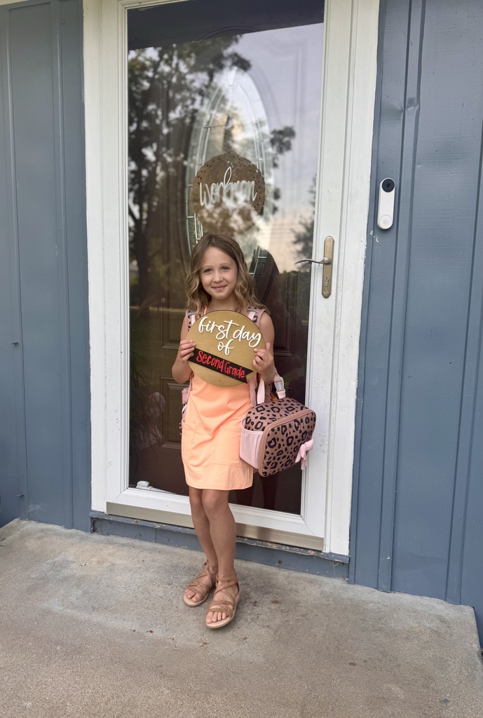 Student posing on the the first day of school.