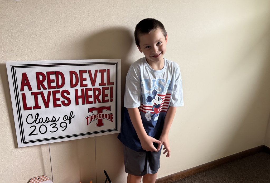 Class of 2039 student holds his sign.