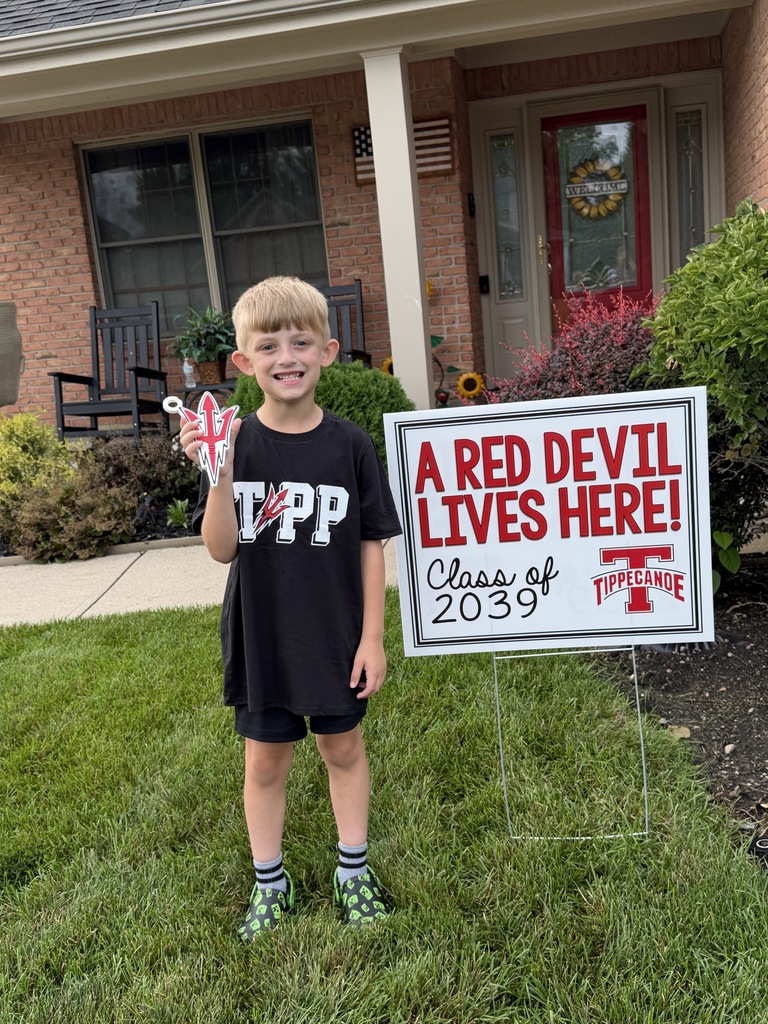 Class of 2039 student holds his sign.