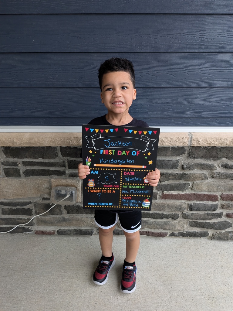 A first day kindergarten picture with one of our students and the Class of 2039 sign.