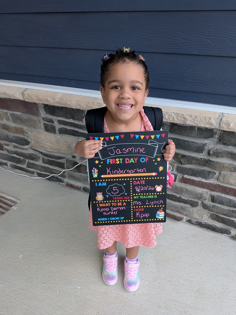 A first day kindergarten picture with one of our students.
