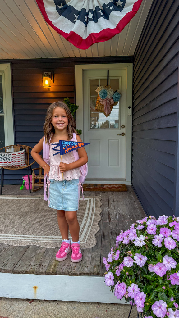 A first day kindergarten picture with one of our students.