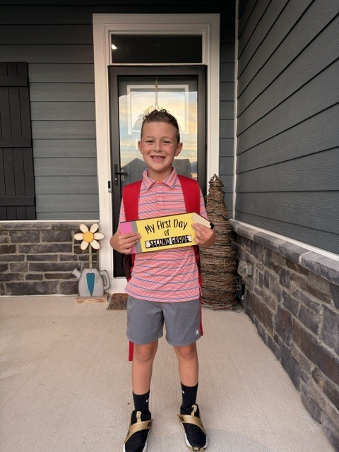 Tipp City Schools students posing for first day photos.
