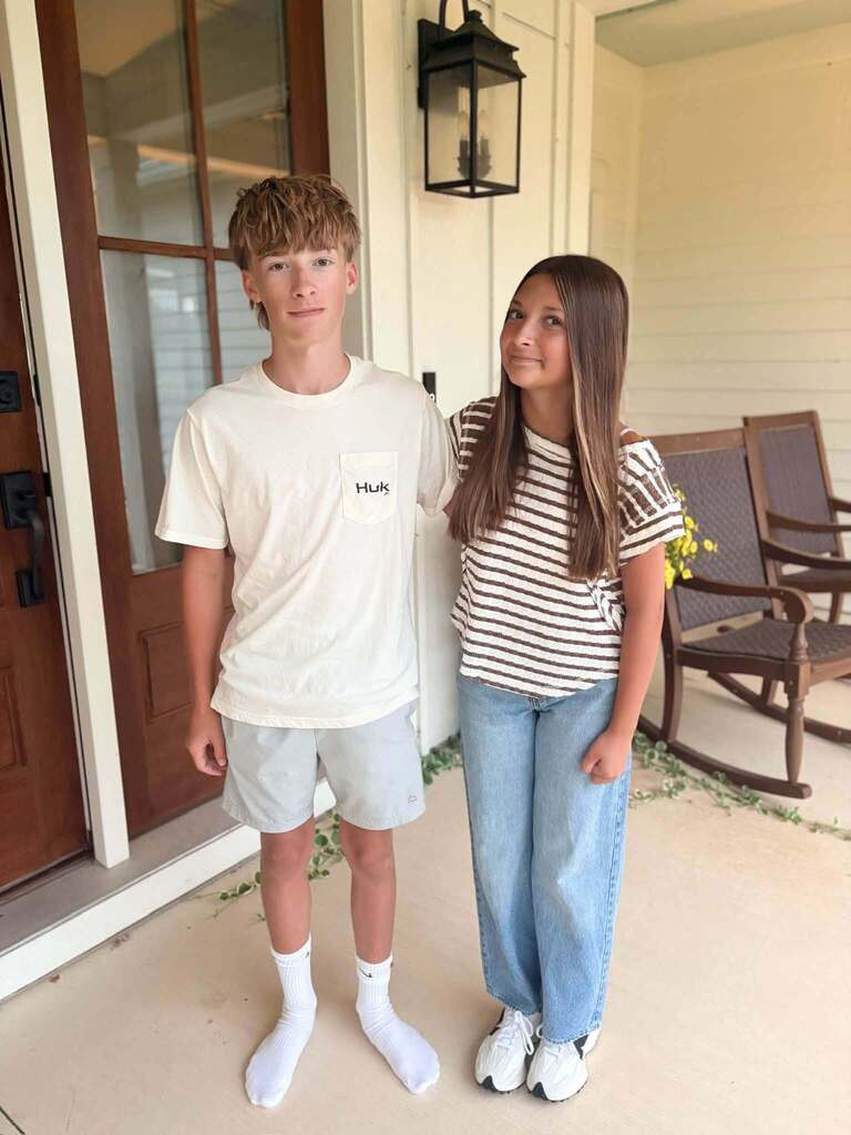 Tipp City Schools students posing for first day photos.