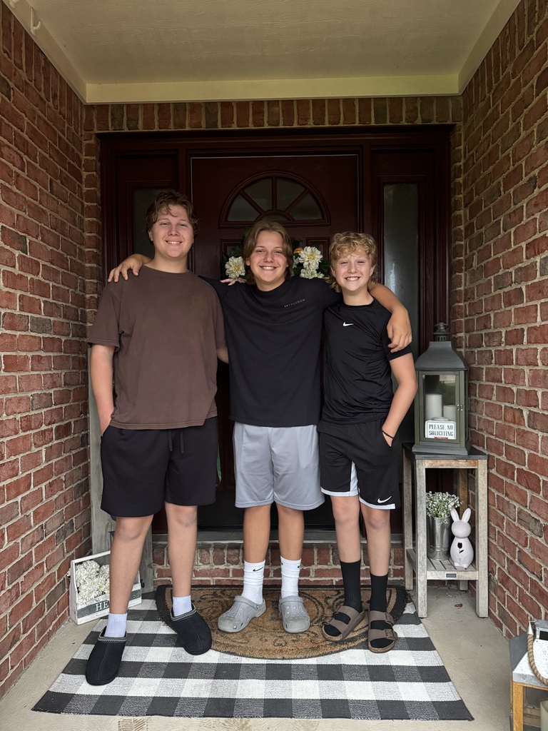 Tipp City Schools students posing for first day photos.