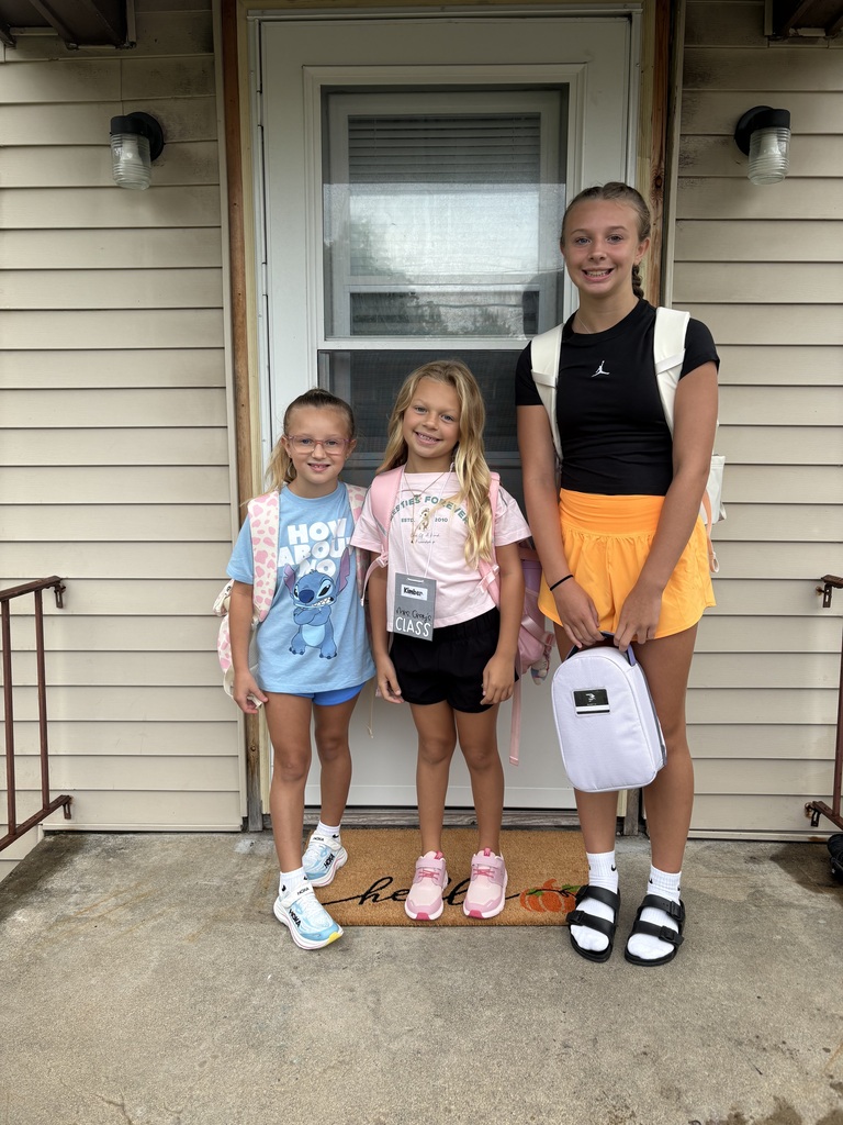 Tipp City Schools students posing for first day photos.
