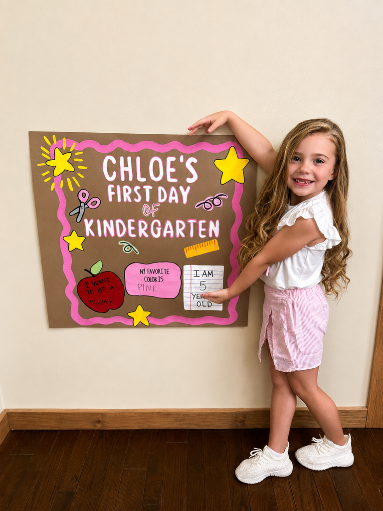 A kindergarten student is ready for the first day of school as she poses for a picture.