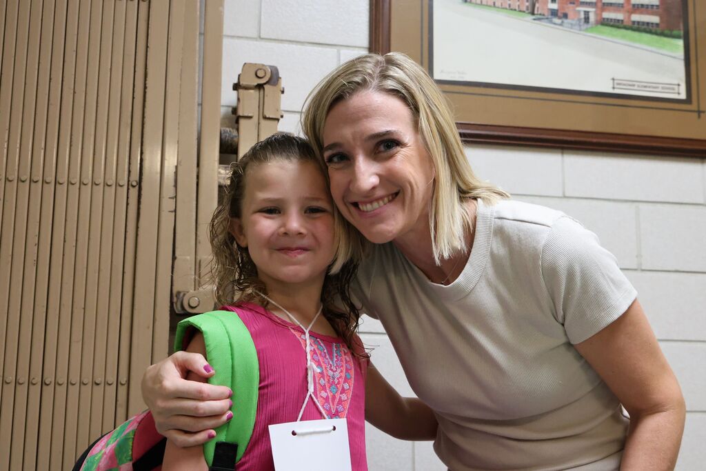 A Broadway Elementary student is all smiles on the first day of kindergarten as she poses with Mrs. Gress.