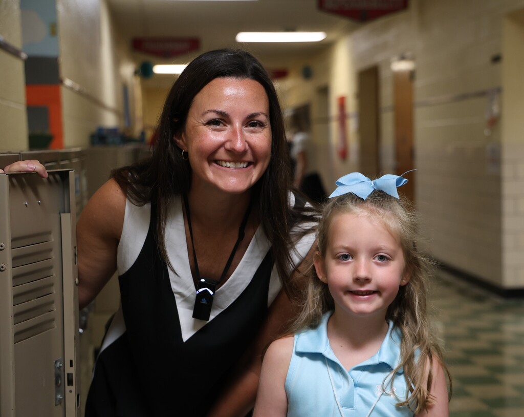A Broadway Elementary student is all smiles on the first day of kindergarten with her teacher.
