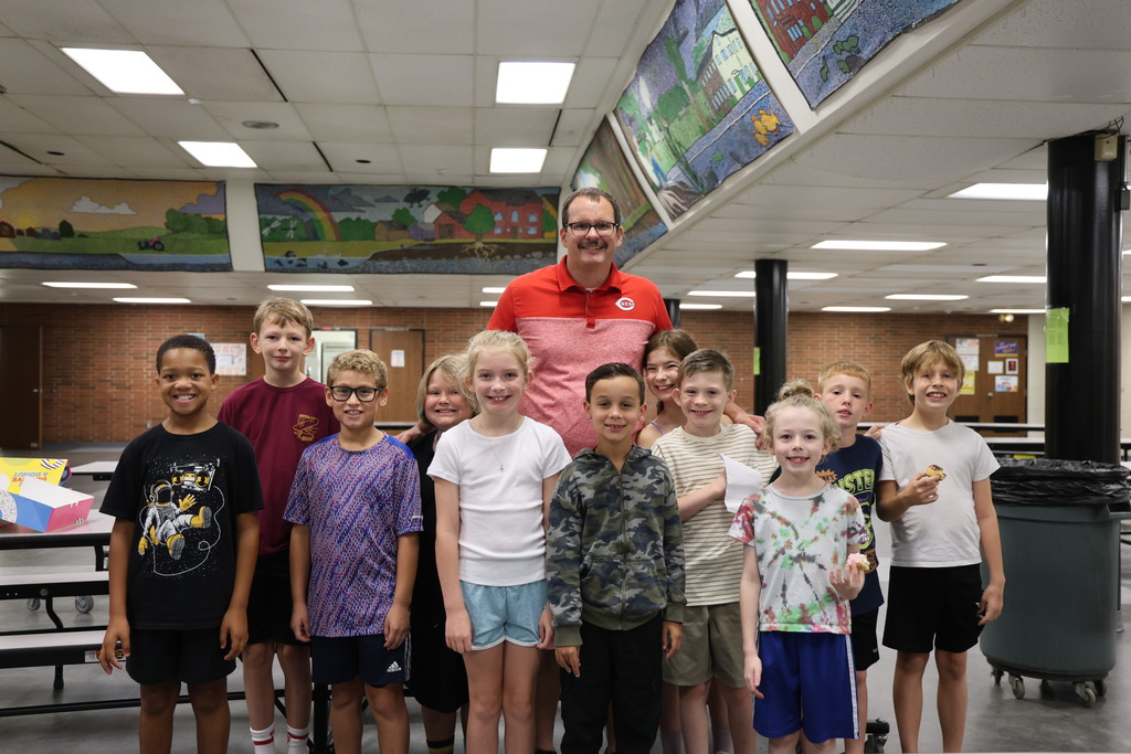 A group shot of Mr. Elliott and new students at LT Ball. 