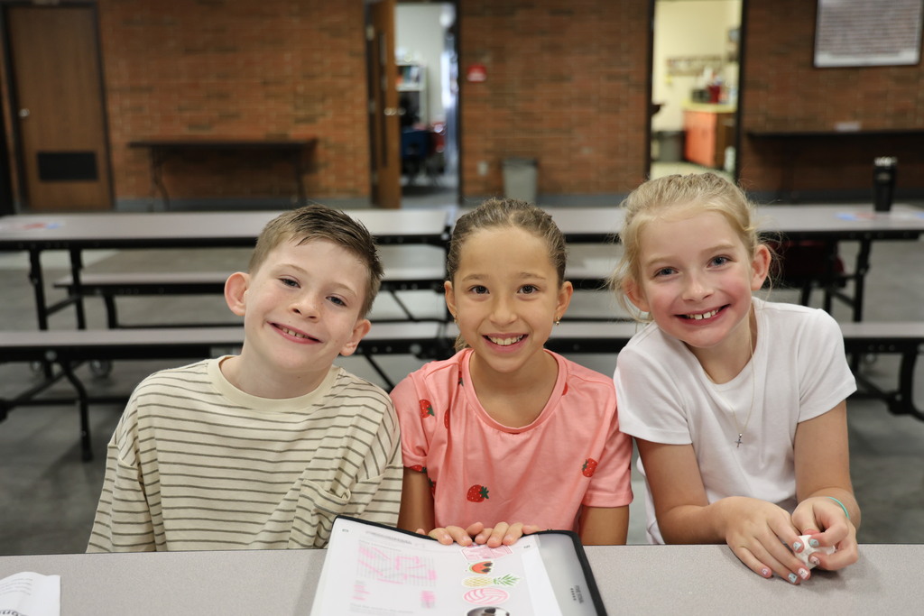 Three students new to the district enjoy a morning with their counselor. 