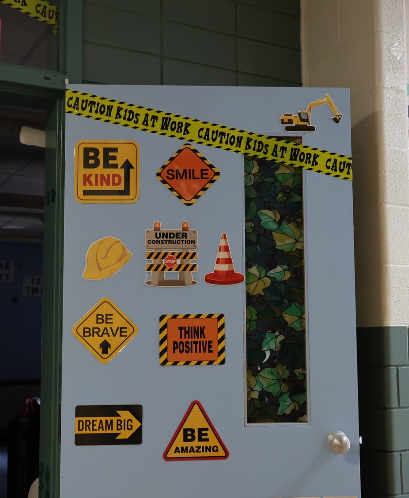Broadway Elementary classroom door that is under construction with different construction signs.  